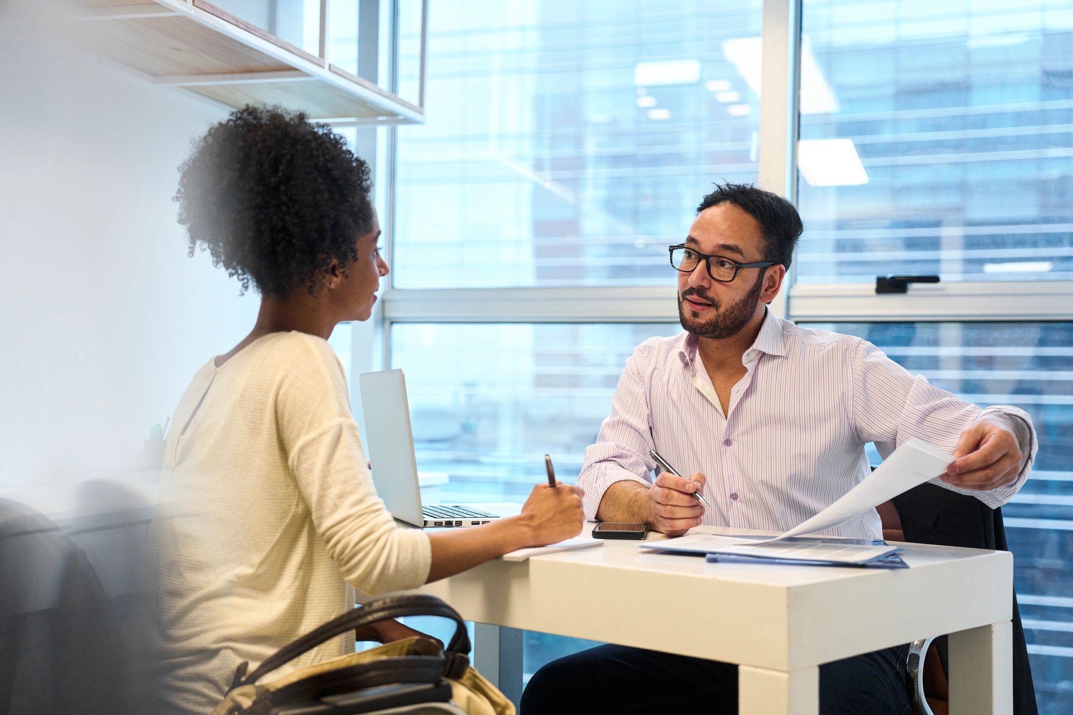 Advisor discussing coverage options with a client at an office