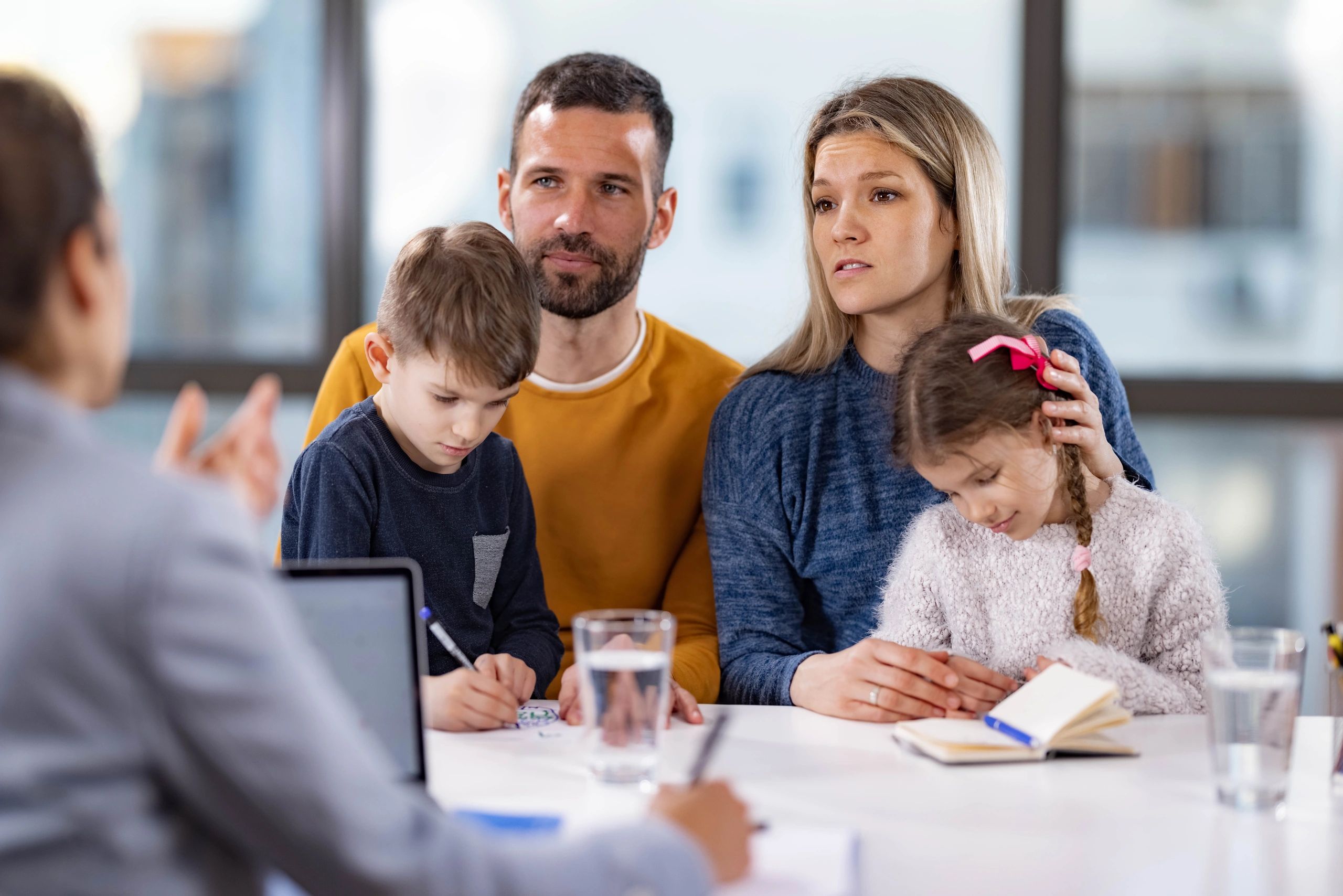 Family meeting with an advisor in an office