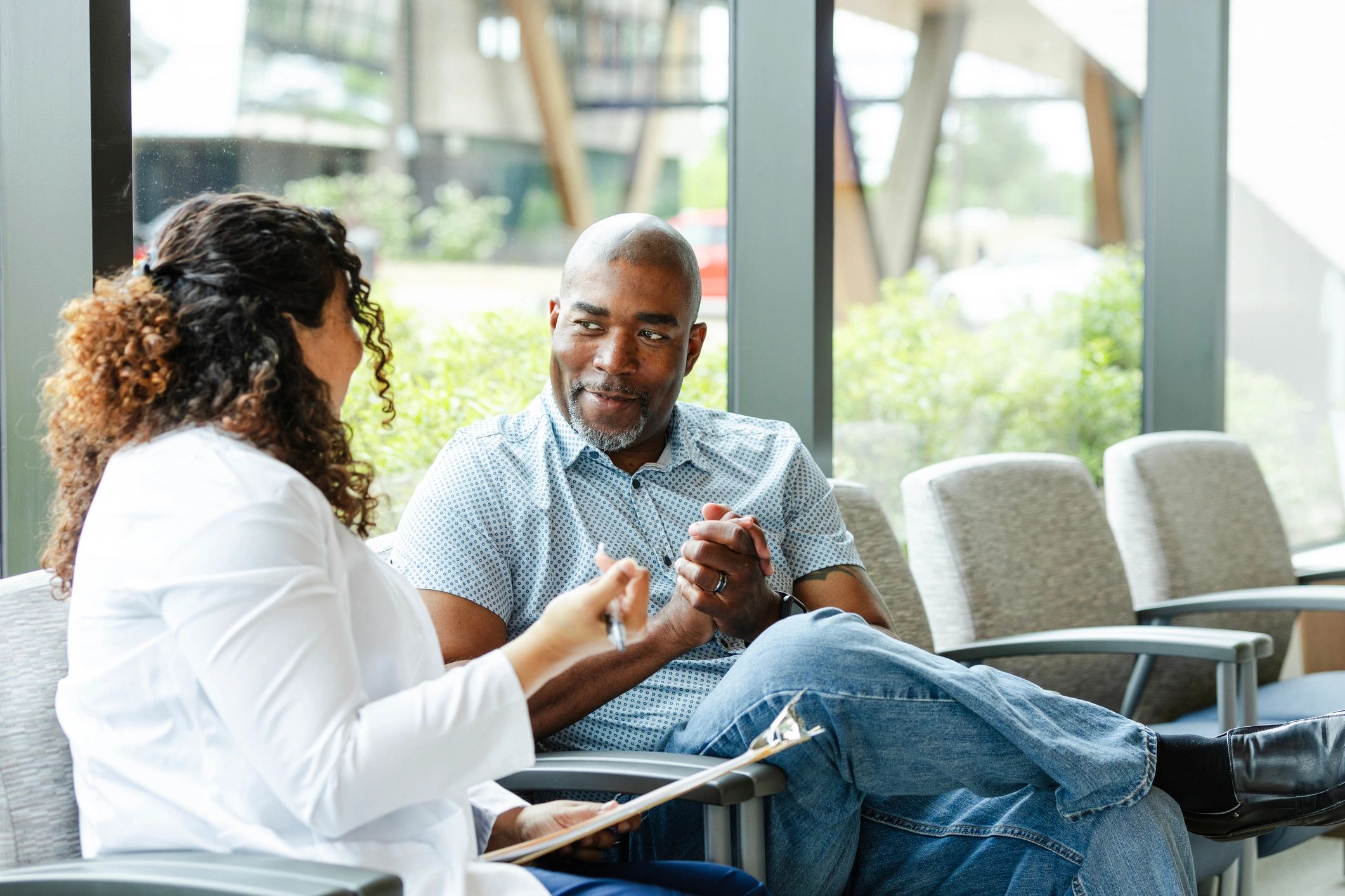 Doctor and patient reviewing paperwork during a consultation