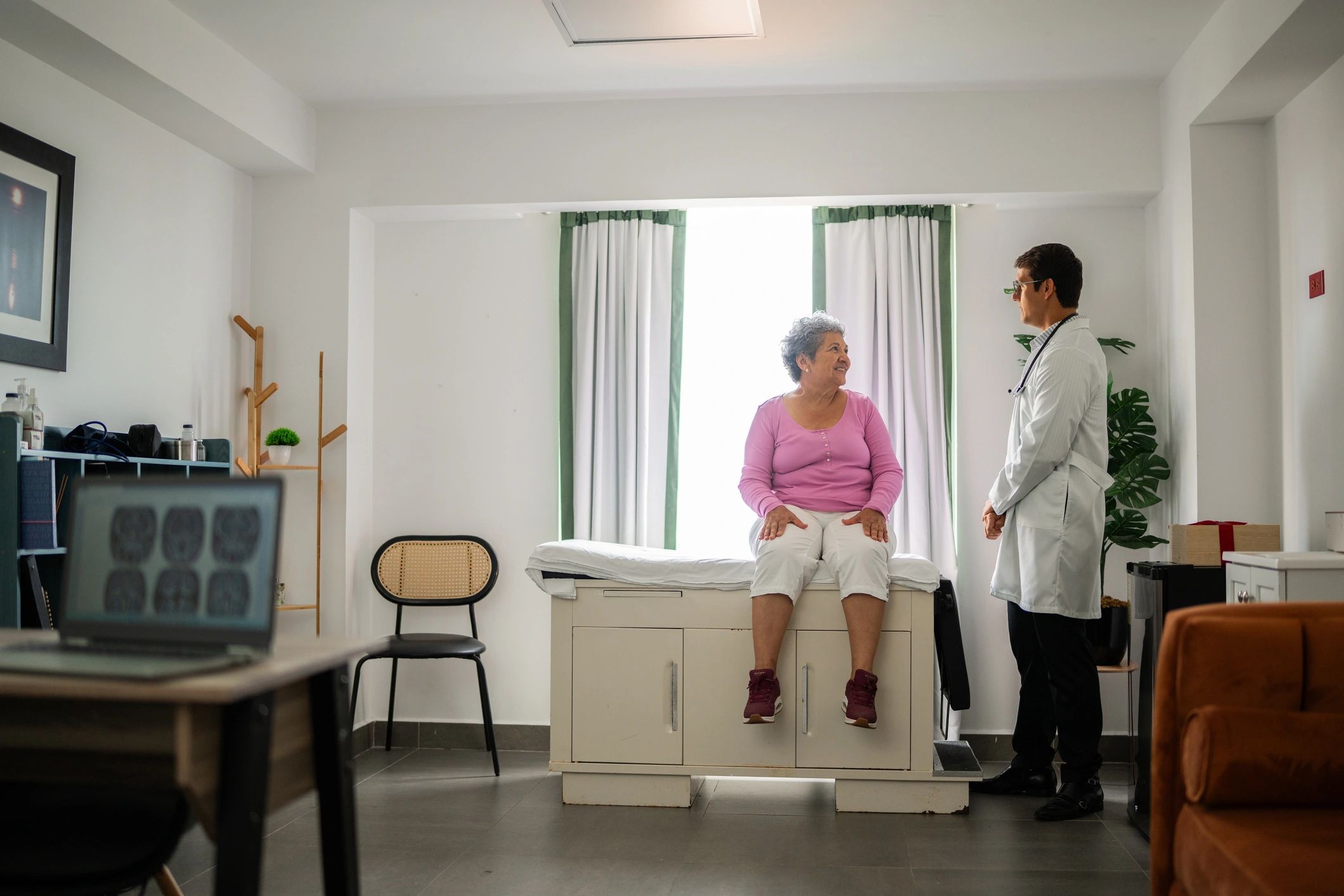 Doctor consulting with a senior patient