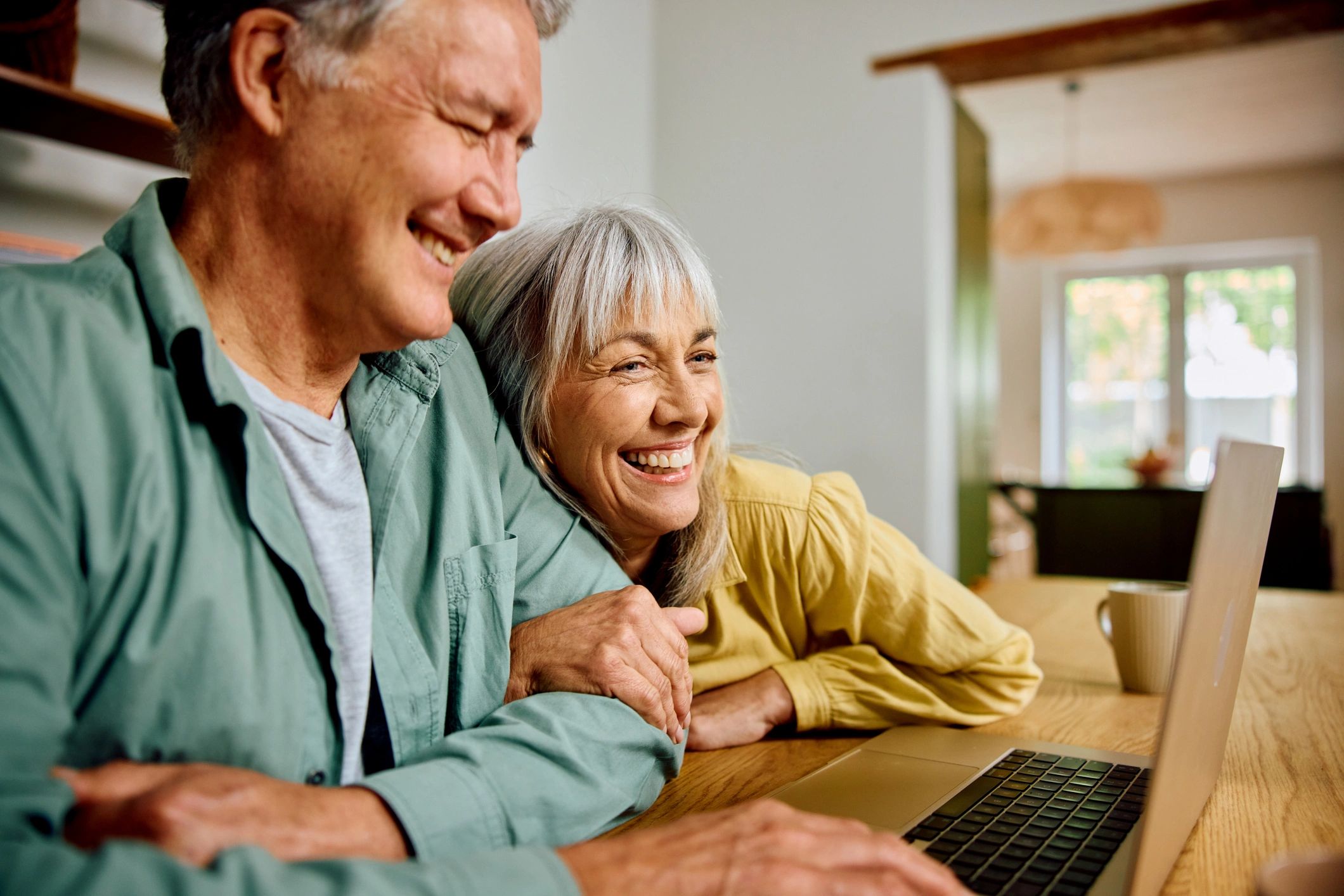 Senior couple reviewing insurance options together at home