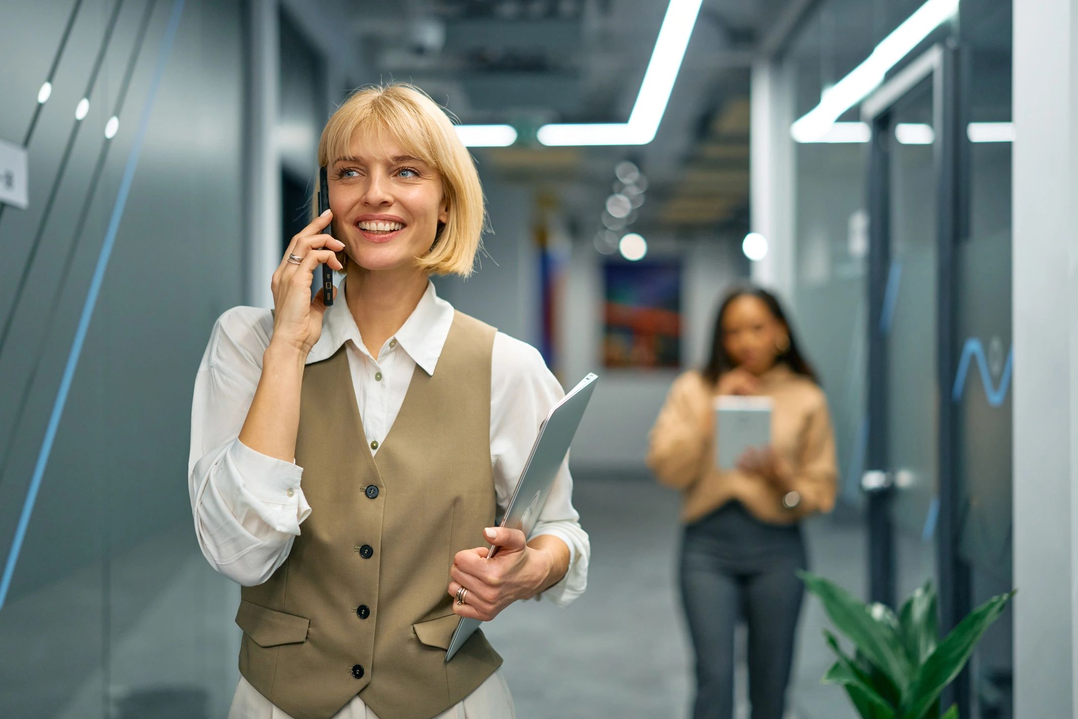 Smiling professional speaking on the phone